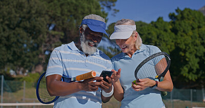 Buy stock photo Tennis, couple and laugh with phone on court for social media, meme and fun with sports bloopers. Interracial people, mature or outdoor with mobile for entertainment, fitness app or tracking progress