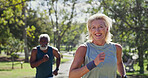 Fitness, senior couple and running in park for wellness, cardio exercise and training in retirement. Elderly people, smile and outdoor for workout with support, racing and friends on path with energy