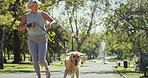 Park, woman and happy for running with dog for fitness, exercise and workout in England. Mature person, outdoor and smile with jog as pet owner or animal on with adoption, support and self care