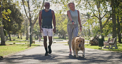 Buy stock photo Park, couple and happy for walking with dog for fitness, exercise and workout for health. Outdoor, interracial and mature people in relationship with pet or animal for support, care and bonding