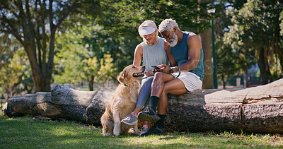 Buy stock photo Mature couple, dog and park with phone in retirement with social media and pet outdoor. Morning, love and care of interracial relationship with animal, fitness break and tech with golden retriever