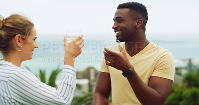 Buy stock photo Travel, ocean and happy couple cheers at hotel for tropical vacation with love, relax or bonding. Drinks, man and woman at beach resort with toast, smile or interracial relationship on island holiday