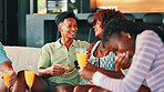 Talking, laughing and group of friends on sofa drinking mimosas on weekend together. Conversation, fun and people enjoying drinks in living room for gossip or bonding in home for social event.