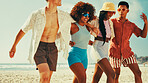 Happy, fashion and friends walking on beach for summer vacation, holiday and adventure together. Nature, travel and men and women by ocean or sea for bonding, relax and laughing on weekend outdoors