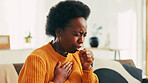 Coughing, sick and black woman in home with flu, cold or allergies with viral infection. Illness, recovery and African female person with respiratory  issue, tuberculosis or asthma in living room.