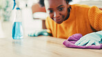 Housekeeping, spray bottle and black woman with fabric cloth, cleaning and remove bacteria. Dust, apartment and African person with chore, virus safety or routine with disinfectant or hygiene product