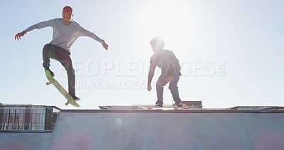 Buy stock photo Men, skateboard and skating jump at park with balance, fitness and practice action trick for sports competition. Flare, skater and people training for performance, recreation or adventure with talent