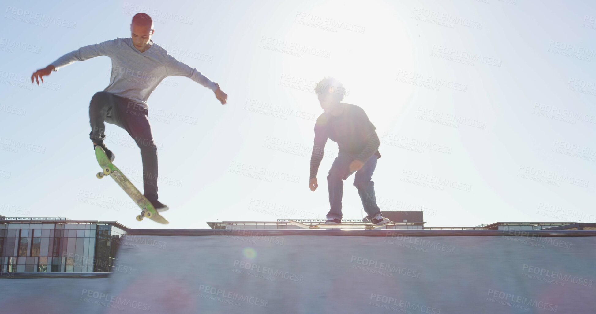 Buy stock photo Men, skateboard and skating jump at park with balance, fitness and practice action trick for sports competition. Flare, skater and people training for performance, recreation or adventure with talent