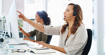 Buy stock photo Pointing, call center and woman on computer in office for talking, online help and consulting. Customer support, business and person with headset for virtual assistant, communication and b2c contact