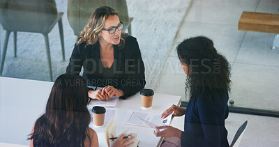 Buy stock photo Business people, conversation and women in office, above and feedback for financial report. Employees, advice and mentor in workplace, cooperation and meeting for project development and planning
