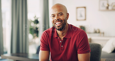 Buy stock photo African man, portrait and happy in home with relax, weekend break and chill on sofa. Person, laugh and stress free in living room for rest, good mood and enjoy me time in apartment lounge with smile