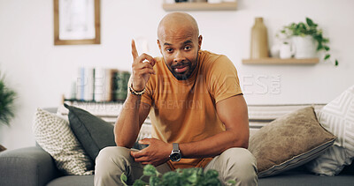 Buy stock photo Man, portrait and pointing up for information with advertising in home, presentation or about us. Guide, menu or news with direction, review and African male person with gesture for announcement