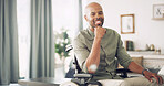 Portrait, confident and man with smile, wheelchair and chilling in living room, relax and apartment. Happiness, pride and black person with disability in lounge, break and calm in home or Namibia