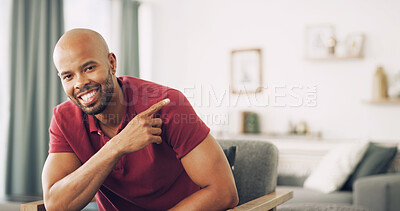 Buy stock photo Man, portrait and point for information with advertising in home, presentation or about us. Guide, menu or news with direction, review and African male person with gesture for announcement