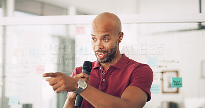 Buy stock photo Presentation, speaker and man with mic, confident and information for seminar, training and talking. Business, employee and black person with speech for workshop, pointing or tech for public speaking