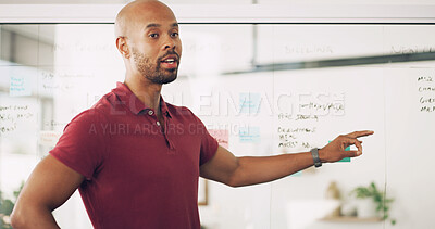 Buy stock photo Presentation, talking and man with info, office and glass board with notes, training and newsroom. Pointing, journalist and black person with plans for project, advice and public speaking in workshop