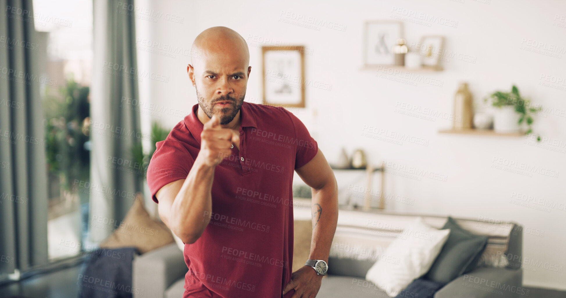 Buy stock photo Pointing, serious and portrait of man in home for discipline, blame or confrontation in living room. Angry, fighting and male person from Puerto Rico with finger for scolding with upset face in house