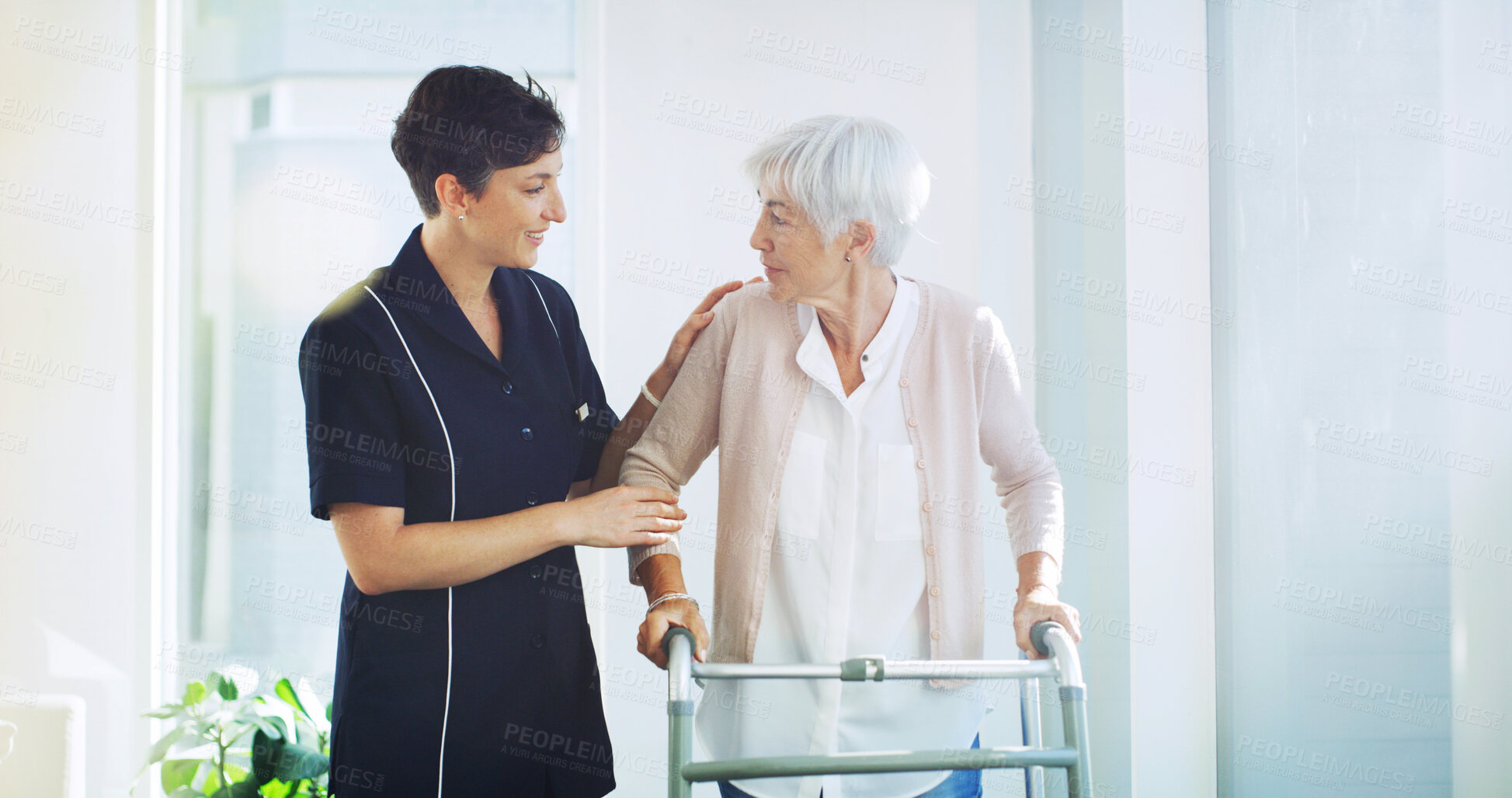 Buy stock photo Support, caregiver and old woman with walker in home for healthcare, physiotherapy or help in retirement. Senior care, nurse and elderly person with walking frame for mobility exercise in recovery