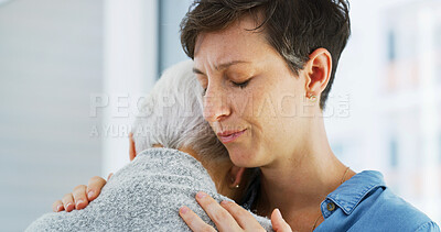 Buy stock photo Crying, comfort and woman hugging senior mother in retirement home for grief, support or loss. Sad, love and female person embracing elderly mom for empathy, care and emotions in nursing facility.