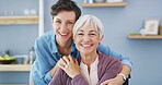 Hugging, portrait and woman with senior mother on sofa for bonding, connection and family time. Happy, love and female person embrace elderly mom with care in living room for visit at retirement home