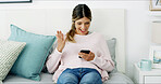 Woman, phone and smile with surprise on sofa, chat and check notification in living room at in home. Person, happy and wow with smartphone, mobile app and gossip on social network at apartment