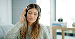 Listening, smile and woman with headphones, home and streaming playlist on break, living room and online. House, relax and person with tech for music, chilling and entertainment with radio in lounge