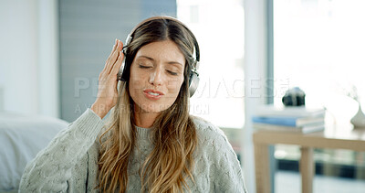 Buy stock photo Listening, smile and woman with headphones, home and streaming playlist on break, living room and online. House, relax and person with tech for music, chilling and entertainment with radio in lounge