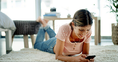 Buy stock photo Woman, phone and happy on floor with relax, social media and funny message in text. Female person, mobile and laugh in home for meme website, comedy video and gossip conversation on contact app
