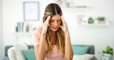 Buy stock photo Woman, sofa and stress with headache, migraine or anxiety with massaging temple in living room. Tension, mental health and wellness discomfort, crisis and worried female person frustrated in home