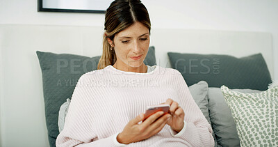 Buy stock photo Woman, texting and relax with phone on sofa, chat and check notification in living room at in home. Person, connection and scroll on smartphone, mobile app and contact on social network at apartment