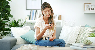 Buy stock photo Woman, diabetes and test for glucose in home, sofa and self care with results, monitor and check in lounge. Person, stats and blood sample for wellness, tech and assessment on couch at apartment