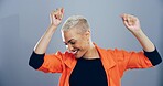 Dance, energy and music with smile of woman in studio for celebration, clubbing or party fun. Happy, moving and music with excited dancer person on gray background mockup for choreography or rhythm