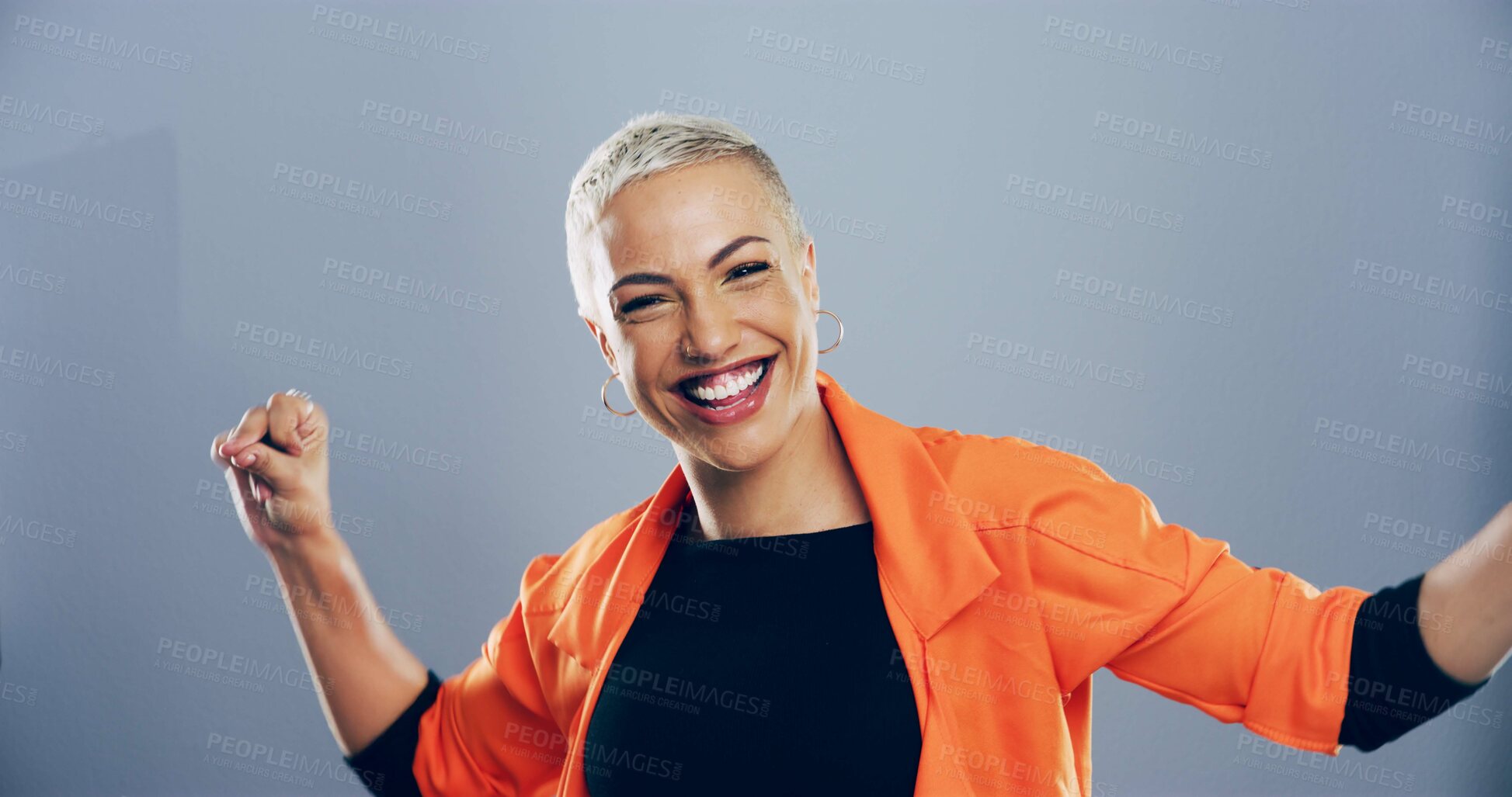Buy stock photo Dance, energy and portrait of excited woman in studio for celebration, clubbing or party fun. Moving, music and smile of happy dancer person on gray background for beat, choreography or rhythm