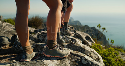Buy stock photo People, legs and hiker with rock on mountain for adventure, trekking journey or fitness in nature. Shoes, feet or couple on cliff with peek or view for hiking trail, travel or sightseeing destination