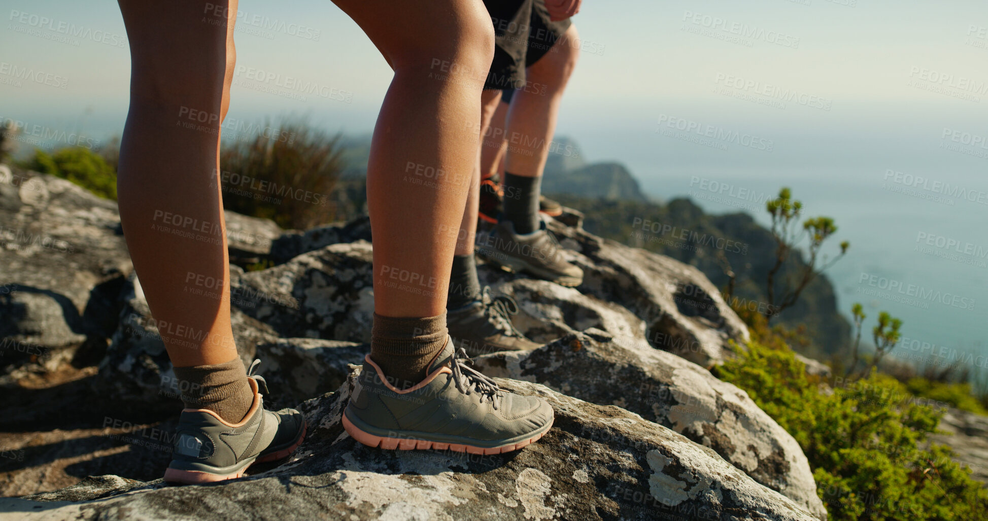 Buy stock photo People, legs and hiker with rock on mountain for adventure, trekking journey or fitness in nature. Shoes, feet or couple on cliff with peek or view for hiking trail, travel or sightseeing destination