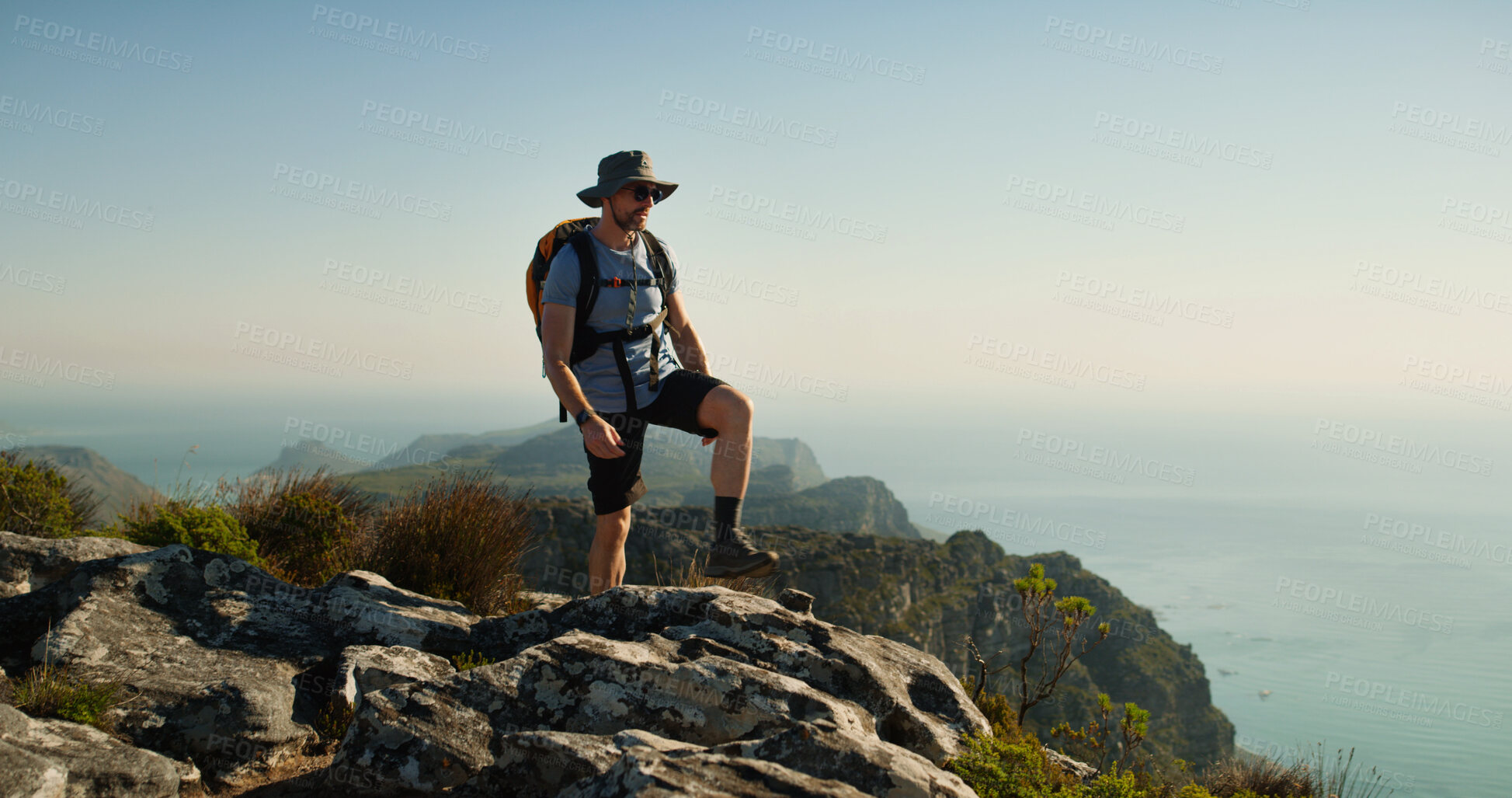 Buy stock photo Hiking, travel and relax with man in nature for fitness, mountain adventure and thinking. Space, rock and mindfulness with person outdoor view on cliff for trekking holiday, tourism explore and peace