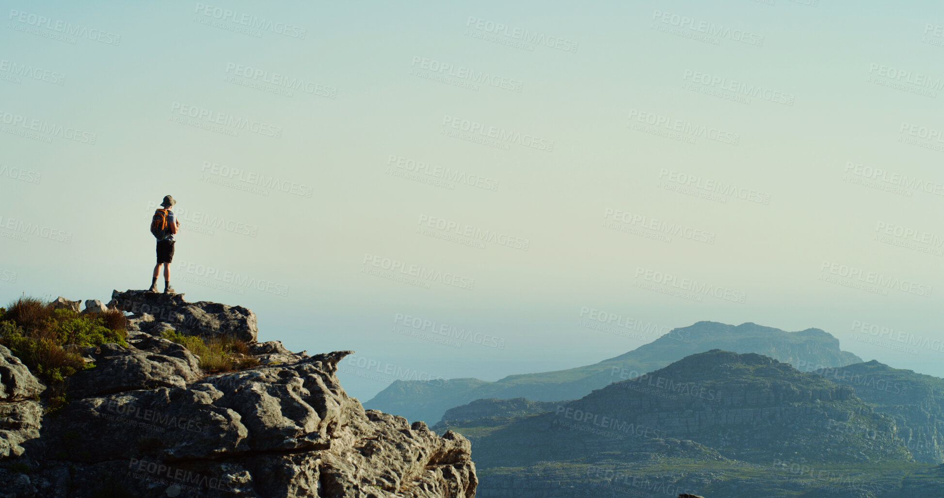 Buy stock photo Person, hiker and mountain view with blue sky on cliff for hiking adventure or conquer in nature. Mockup space, tourist or explorer with bag, peak or horizon for trekking journey, trip or destination