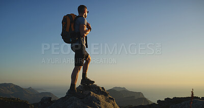 Buy stock photo Back, man and hiker with backpack or mountain view for hiking adventure or conquer on rock. Male person, tourist or explorer with bag on cliff or peak for trekking journey or trip on space in sunset