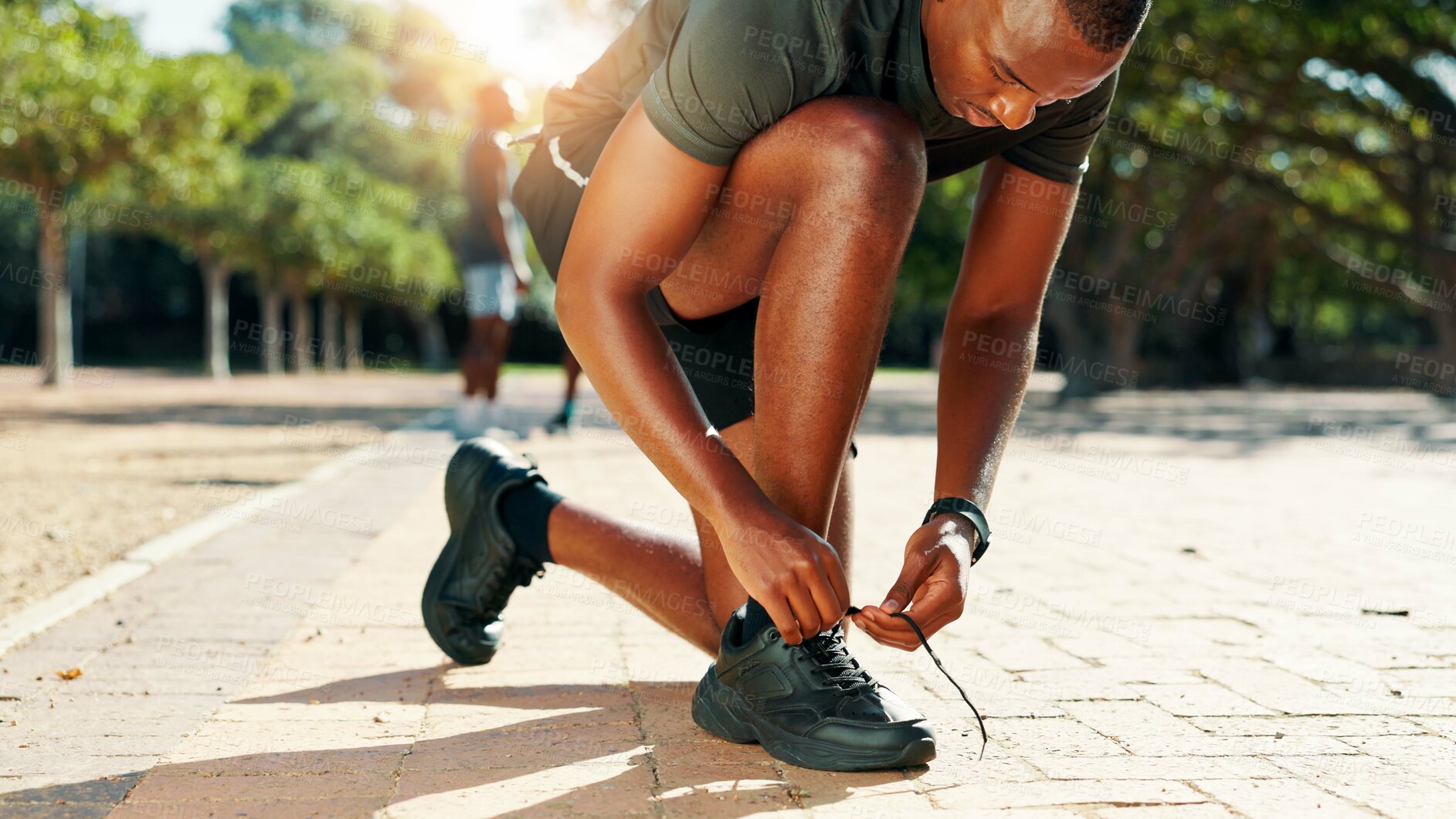 Buy stock photo Runner, black man and tie shoes in park for cardio training, running exercise or fitness workout. Begin, laces and footwear of African athlete on ground ready to start jog, race or marathon practice
