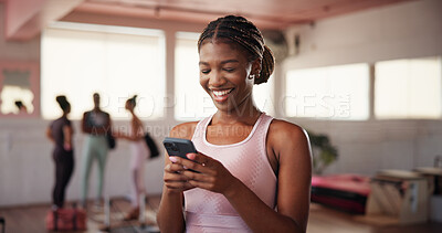 Buy stock photo Gym, woman and happiness with mobile for fitness, exercise video or funny reel on social media. Health club, female person and laugh with smartphone for virtual tutorial, workout break or application