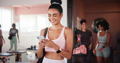 Buy stock photo Woman, smartphone and texting at gym with fitness, contact or excited with smile for stats at club. Girl, phone and mobile app for progress, report and happy for results with chat at exercise class