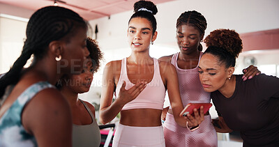 Buy stock photo Women, phone and group with training at gym with smile, results and excited at fitness club. People, friends and smartphone on mobile app, video and coach for advice, listen and exercise at class