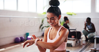 Buy stock photo Pilates, smile and time with woman in studio, tracking performance progress of training routine. Exercise, fitness and watch with happy athlete person in gym class for challenge, milestone or workout