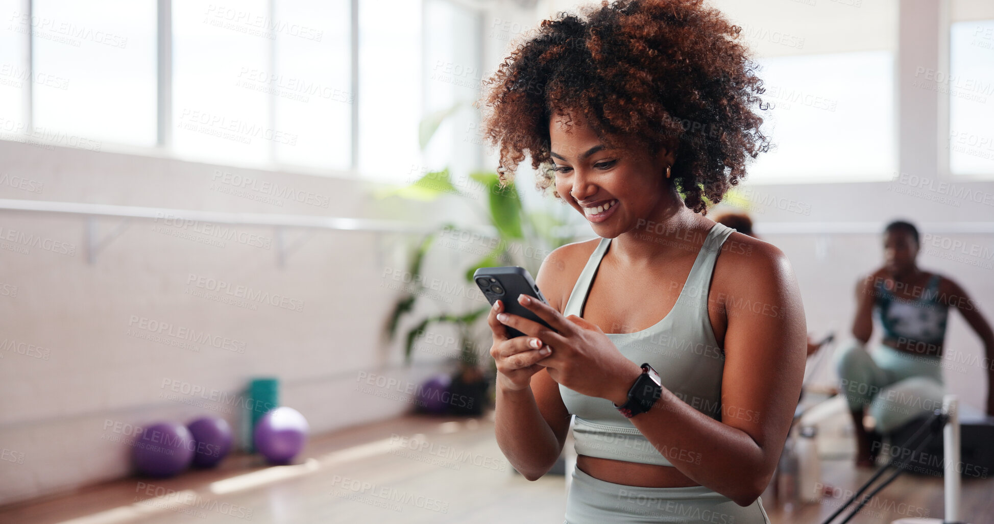 Buy stock photo Gym, happy woman and reading with phone for fitness, health club and application for reel. Online, female person and smile with mobile for exercise video, social media and virtual tutorial for cardio