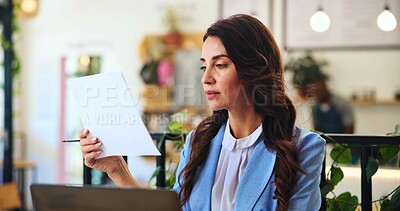 Buy stock photo Documents, reading and laptop with woman in cafe for remote worker, research and planning. Feedback, paperwork and client report with person in coffee shop for freelancer, invoice and information