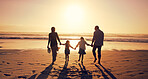 Sunset, family and holding hands at beach for vacation, holiday and bonding together outdoor. Back, mother and father with children at ocean with mockup space, travel or summer adventure with parents