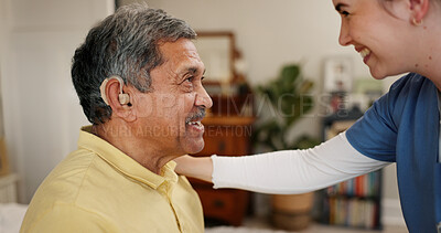 Buy stock photo Nurse, senior man and hearing aid with smile, innovation and healthcare for retirement. Patient with disability, caregiver and pensioner with nursing home, rehabilitation and medical implant support