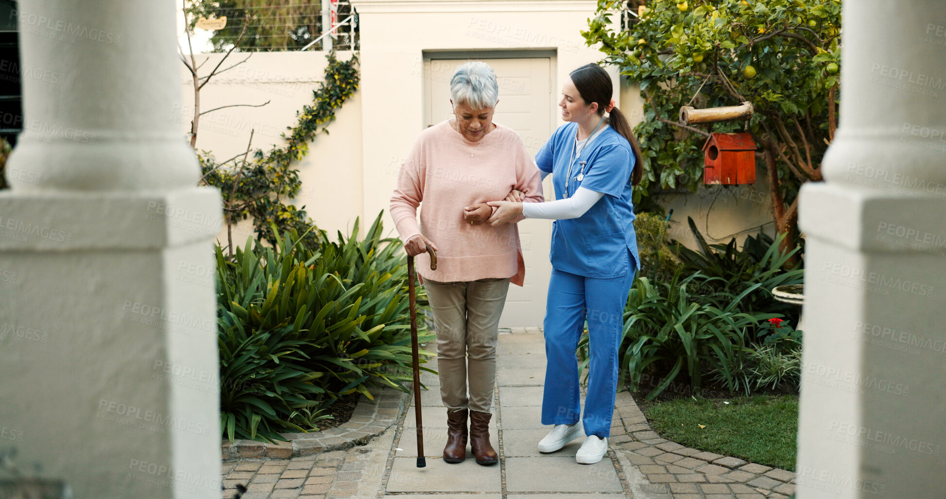 Buy stock photo Nursing home, caregiver and senior woman with walking stick outdoor for mobility, support and medical service. Cane, nurse and elderly person with disability for recovery, healing and rehabilitation