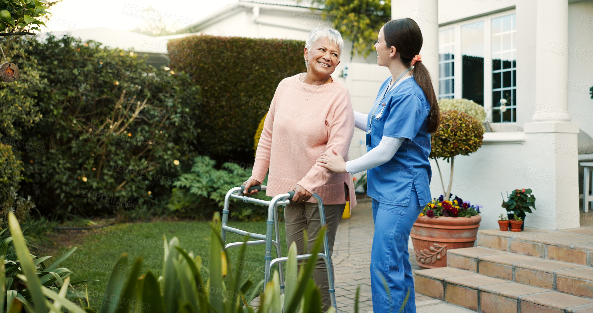 Buy stock photo Retirement home, nurse and senior woman with walker outdoor for mobility support, healthcare and healing. Happy, caregiver and elderly person with disability for recovery, rehabilitation or fresh air