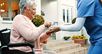 Coffee, nurse and senior woman in wheelchair in garden at retirement home for relaxing morning. Calm, peace and caregiver helping elderly female patient with cup of green tea for health outdoor.